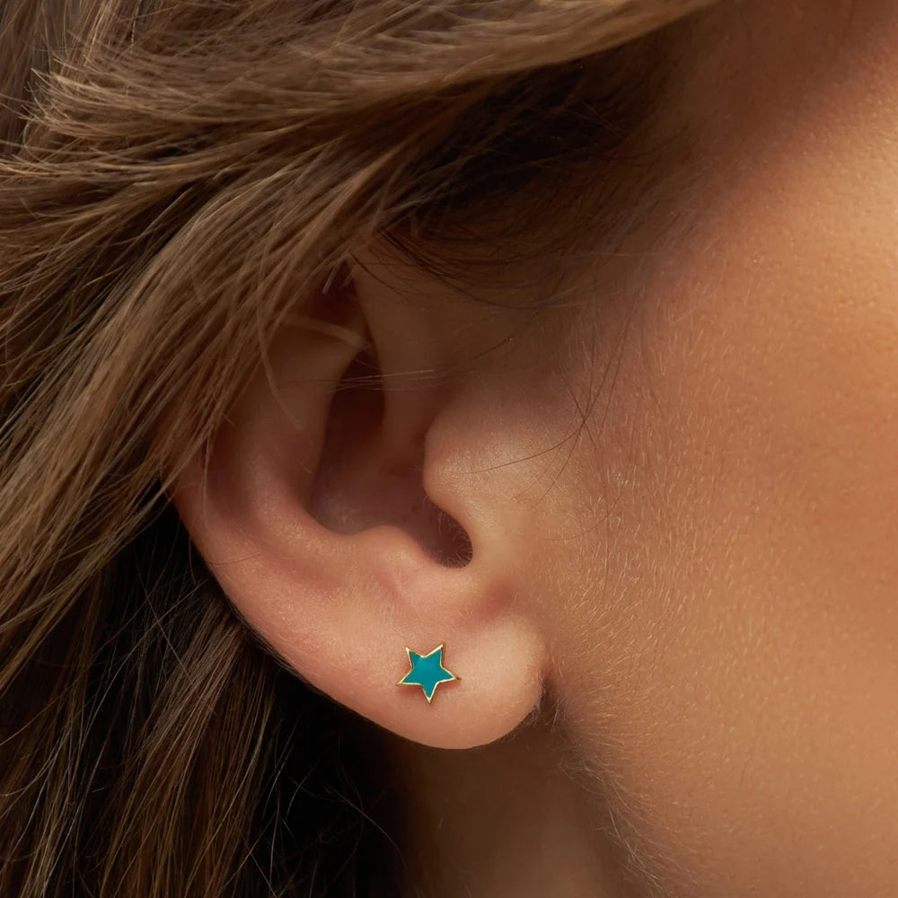 Gold star earring in petrol