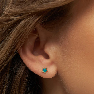 Gold star earring in petrol